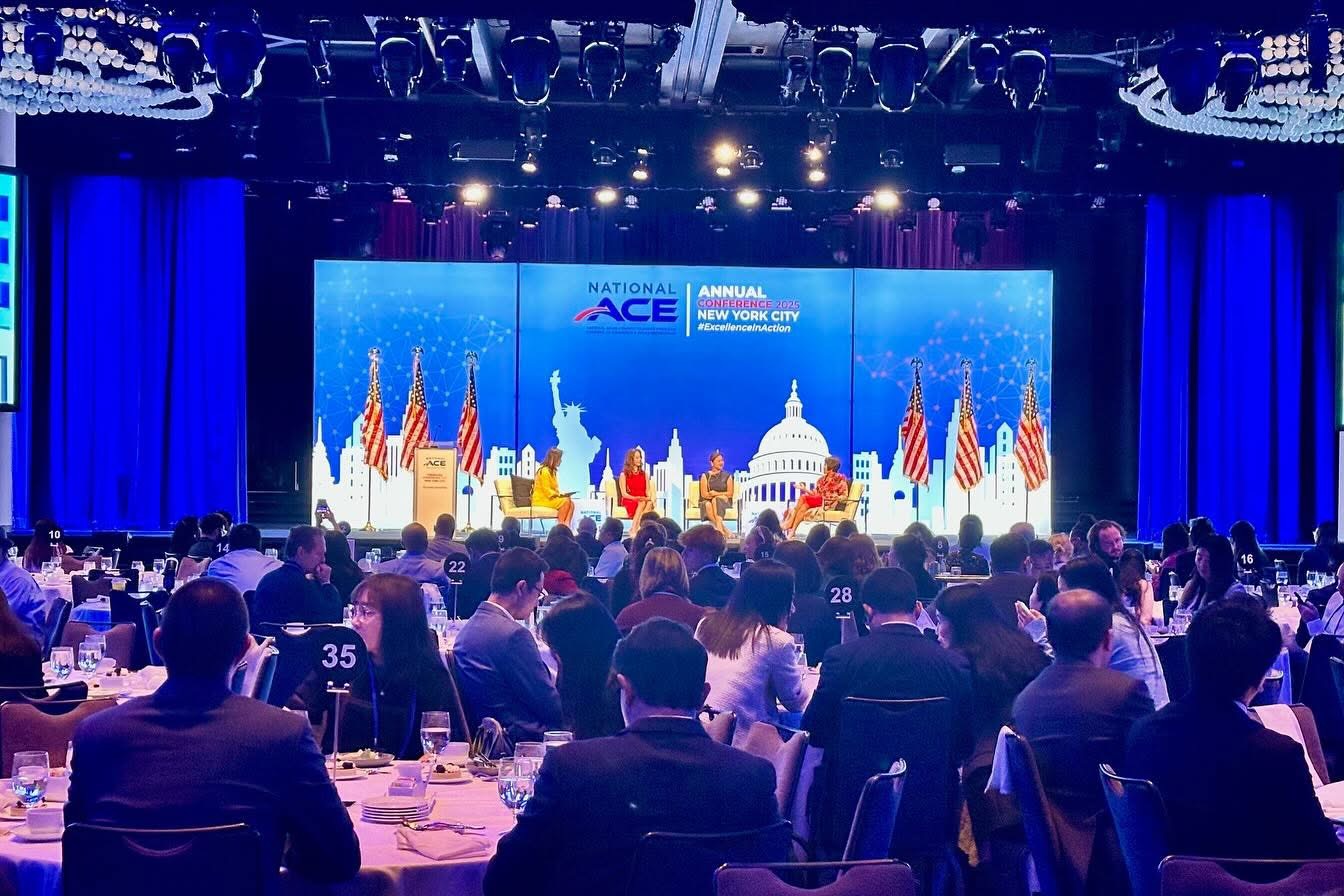 Newin Tech production at a national conference — LED video wall, stage lighting and a full ballroom audience